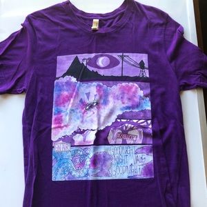 Purple graphic “Canvas” tee.